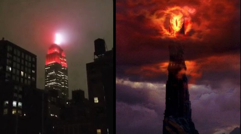 Cena noturna com o olho de sauron brilhando acima das torres