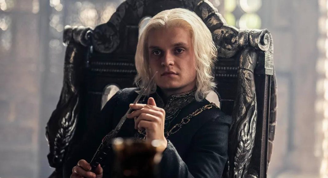 Personagem loiro sentado em um trono medieval.