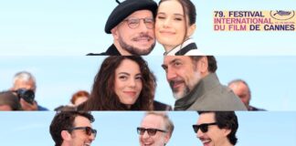 Smiling cast members posing together at the Cannes Film Festival, with the festival logo in the top-right corner.