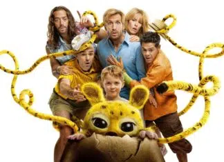 Child and several adults surround a yellow, big-eyed creature peeking from a cracked eggshell, tangled in yellow ropes, on a white background.