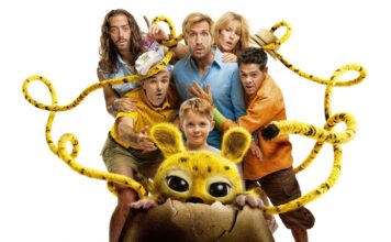 Child and several adults surround a yellow, big-eyed creature peeking from a cracked eggshell, tangled in yellow ropes, on a white background.