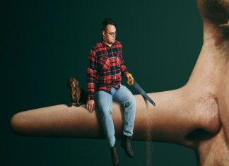 Surreal scene: a man in a red plaid shirt sits on a giant human nose holding a handsaw, with a small dog beside him against a dark green background.