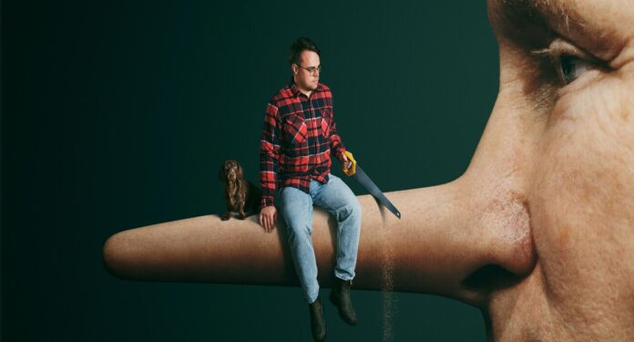 Surreal scene: a man in a red plaid shirt sits on a giant human nose holding a handsaw, with a small dog beside him against a dark green background.