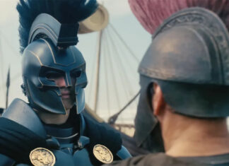 Two armored warriors converse on a ship deck; the left figure wears a blue helmet with a tall plume and plume.