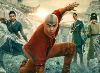 Dynamic fantasy battle scene with four martial artists; central bald hero with arrow on his head leaps forward as debris and water swirl around them in a village square.