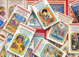 A colorful pile of Choose Your Own Adventure books scattered across a surface in a messy stack.
