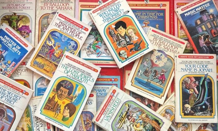 A colorful pile of Choose Your Own Adventure books scattered across a surface in a messy stack.