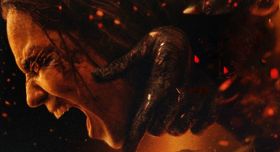 Side profile of a woman screaming as a dark, clawed hand clamps her neck in a fiery, hellish scene.