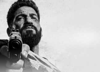 ‘O Justiceiro: Uma Última Morte’: Especial com Jon Bernthal conquista 85% no Rotten Tomatoes; Confira as avaliações da crítica! Bearded man aims a handgun at the camera in a black-and-white close-up shot, low angle.