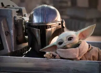 ‘O Mandaloriano e Grogu’ e os Filmes Mais Esperados de Maio 2026 nos CINEMAS! Mandalorian helmeted figure with Grogu (Baby Yoda) leaning forward inside a starship cockpit,