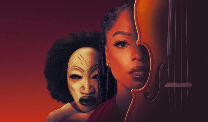 Young woman with a violin partially hiding her face, beside a carved mask against a warm orange gradient background.